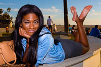 african american girl poses barefoot